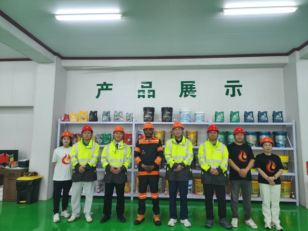 Vision Oil and partner team in a lubricant product showroom